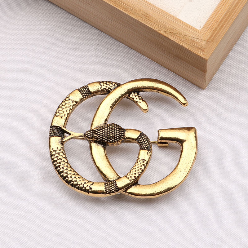 Guc Brooch