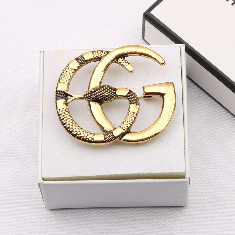 Guc Brooch