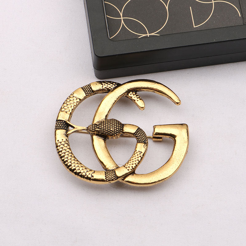 Guc Brooch